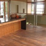 Rich and lustrous custom hardwood floor by Meistercraft Wood Flooring anchors this open concept kitchen
