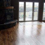 The rich beauty of hardwood flooring around this hearth and entryway - custom flooring by Meistercraft Wood Flooring