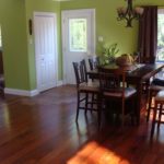 Mix of rich hardwood and ceramic tile add beauty to this foyer; custom hardwood by Meistercraft Wood Flooring