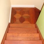 Stairs and custom inlay in landing by Meistercraft Wood Flooring