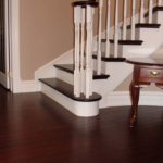 Entrance and curved stairs in custom hardwood by Meistercraft Wood Flooring