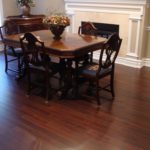 Dark hardwood flooring in elegant dining area by Meistercraft Wood Flooring