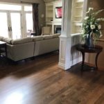 Coffee-coloured hardwood flooring adds elegance to this livingroom by Meistercraft Wood Flooring