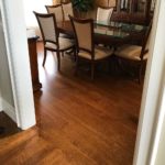 Rich custom hardwood flooring installed in this dining room by Meistercraft Wood Flooring