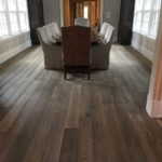 The rich beauty of hardwood adds texture and elegance to this bright diningroom; custom hardwood flooring by Meistercraft