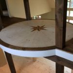 Custom hardwood inlay by craftsman Alex Melchert, owner of Meistercraft Wood Flooring