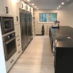 Light solid hardwood flooring brightens this rustic yet modern open concept kitchen - custom hardwood flooring by Meistercraft Wood Flooring